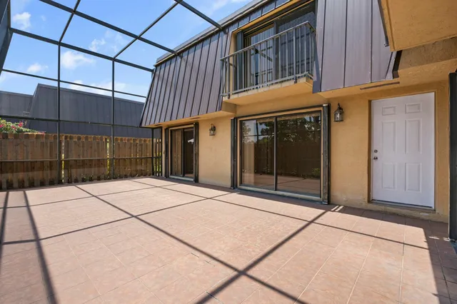 a view of a brick house with a large window