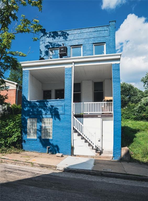 620 Kirkpatrick Street Pittsburgh, PA 15219 - Photo 1 of 15 a front view of a house with a yard