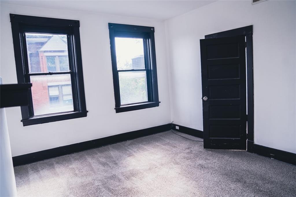 620 Kirkpatrick Street Pittsburgh, PA 15219 - Photo 4 of 15 an empty room with windows