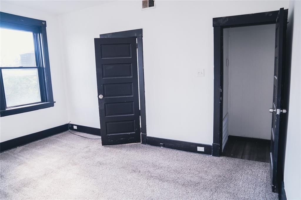 620 Kirkpatrick Street Pittsburgh, PA 15219 - Photo 6 of 15 an empty room with windows and closet