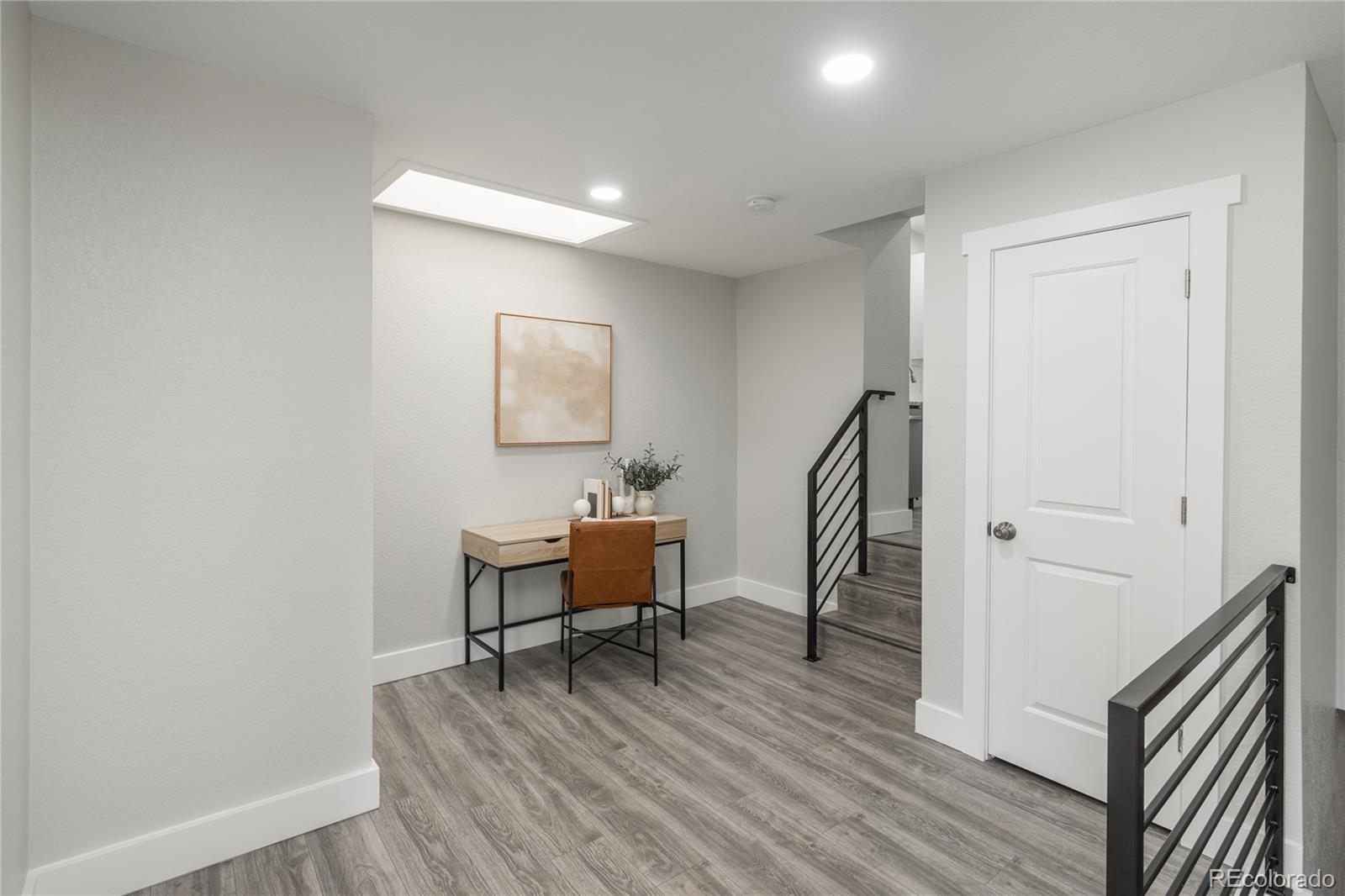 2339 South Acoma Street Denver, CO 80223 - Photo 20 of 36 a view of a room with wooden floor and furniture