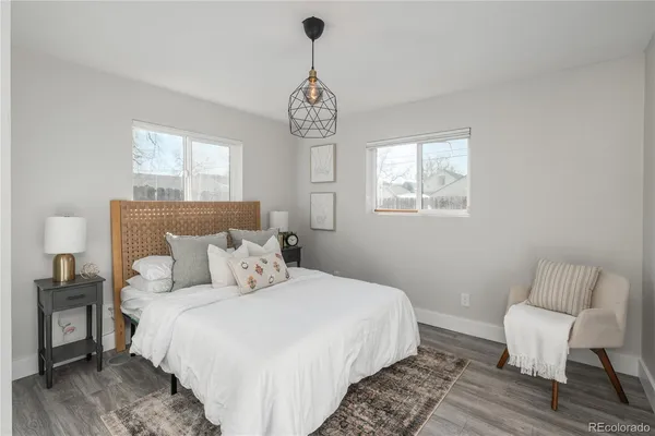 a bedroom with bed and a window