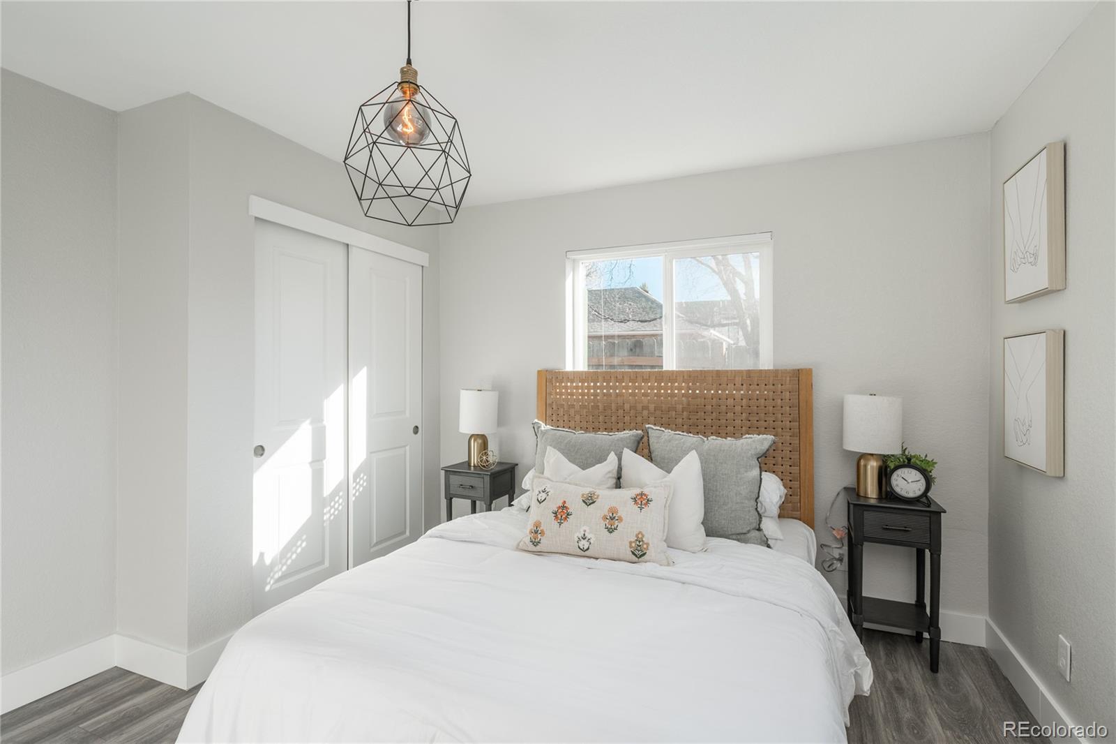 2339 South Acoma Street Denver, CO 80223 - Photo 23 of 36 a bedroom with a bed and a window