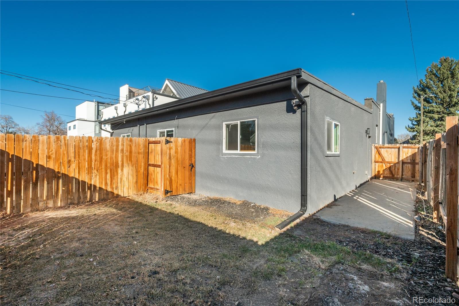 2339 South Acoma Street Denver, CO 80223 - Photo 32 of 36 a view of a house with a backyard