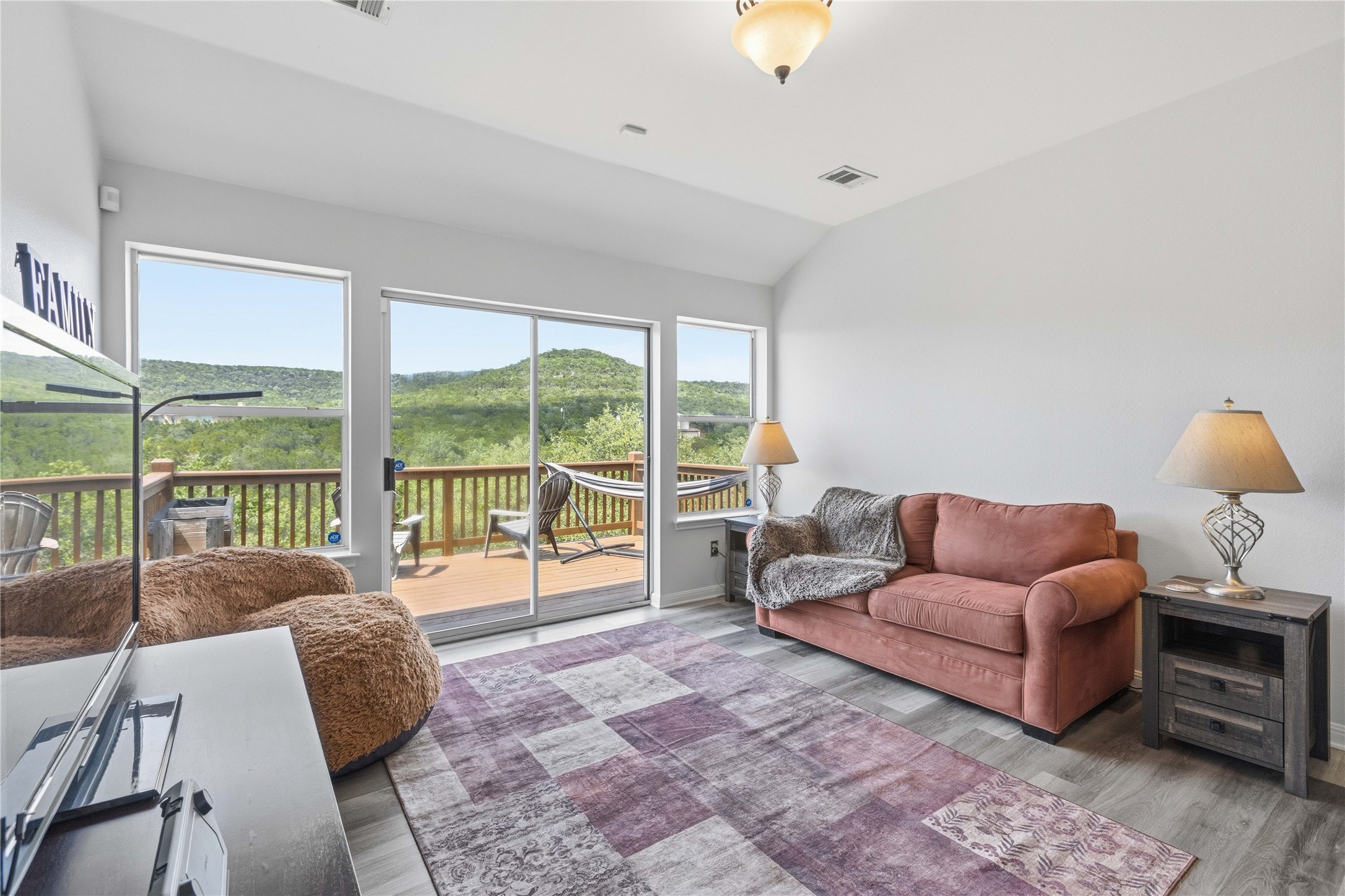 8122 Lime Creek Road Volente, TX 78641 - Photo 17 of 40 Upstairs den with panoramic hill country views that goes to the upper deck