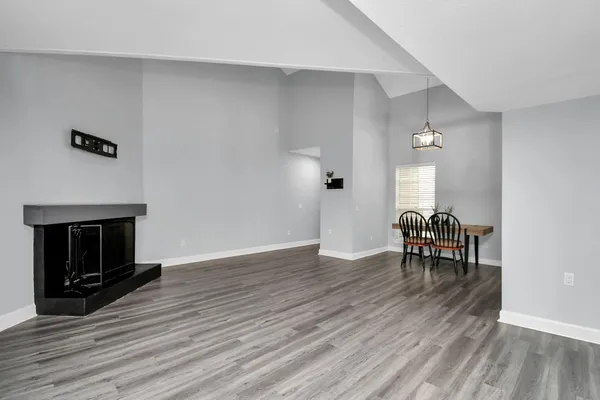 a view of dining room with furniture and wooden floor