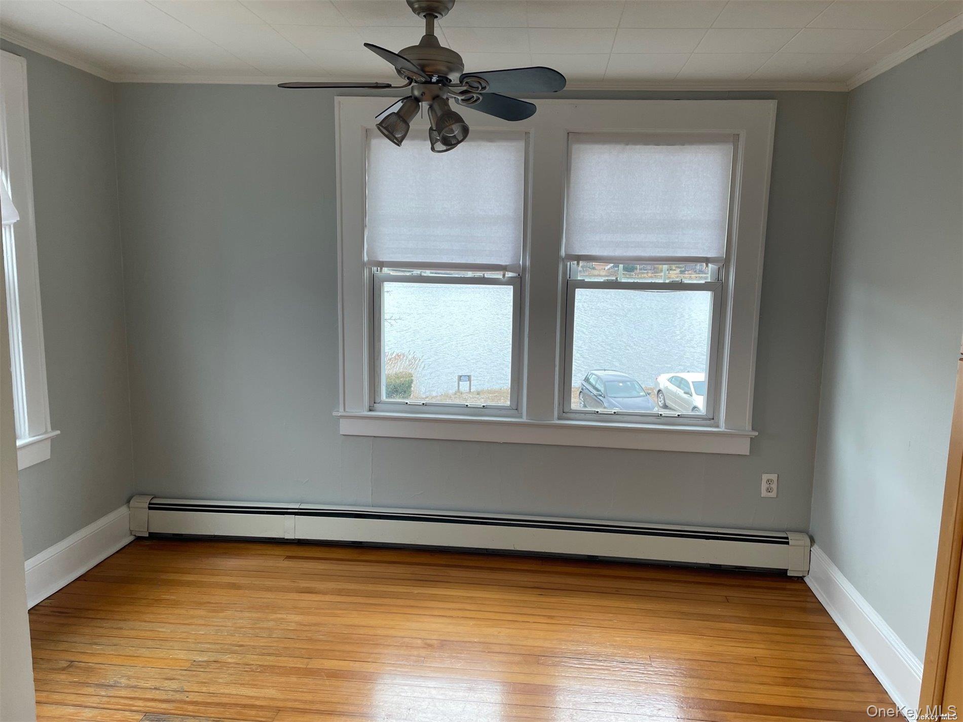 51 Centershore Road, Unit UPPR Centerport, NY 11721 - Photo 16 of 20 a view of a room with window and wooden floor