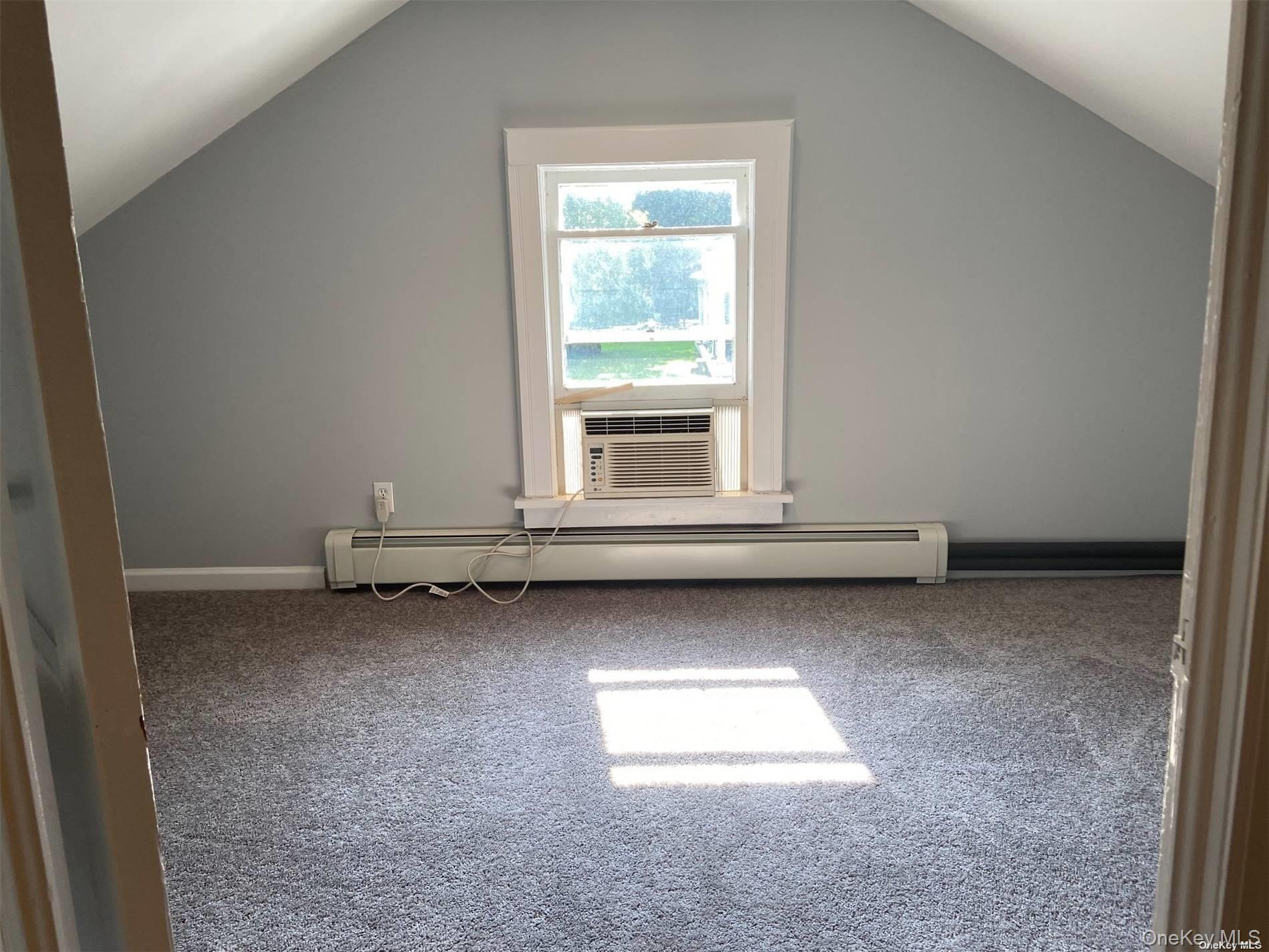 51 Centershore Road, Unit UPPR Centerport, NY 11721 - Photo 19 of 20 a view of a room with wooden floor and window