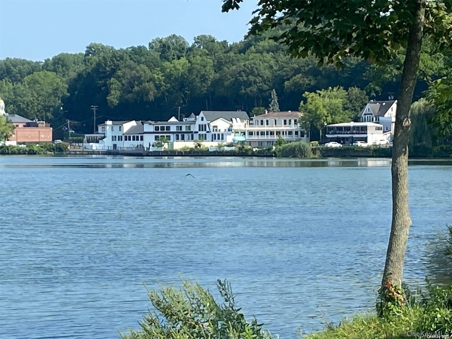 51 Centershore Road, Unit UPPR Centerport, NY 11721 - Photo 20 of 20 a front view of a house with garden