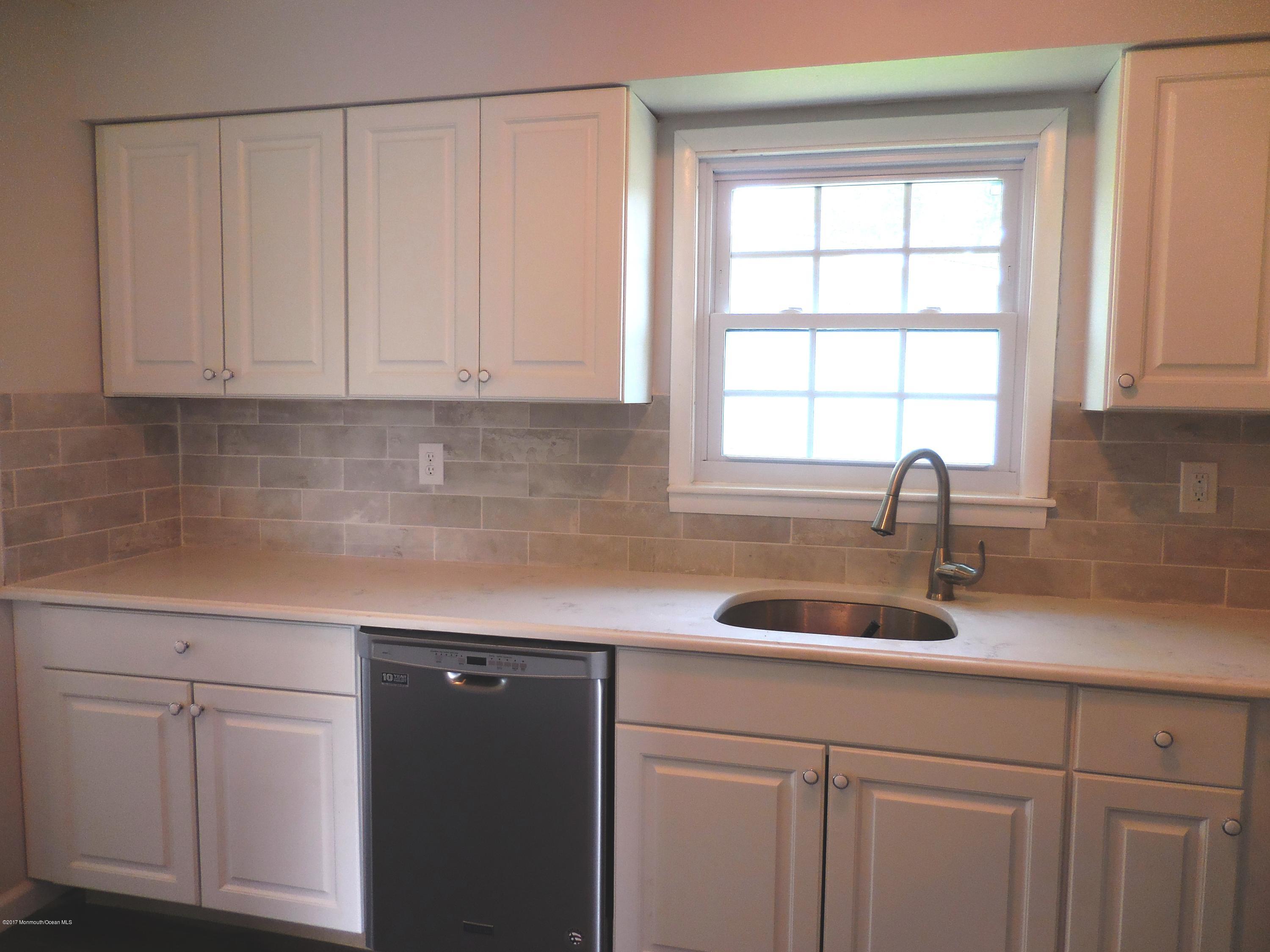 10 Brooke Road Brick, NJ 08724 - Photo 5 of 38 a kitchen with a sink cabinets and window