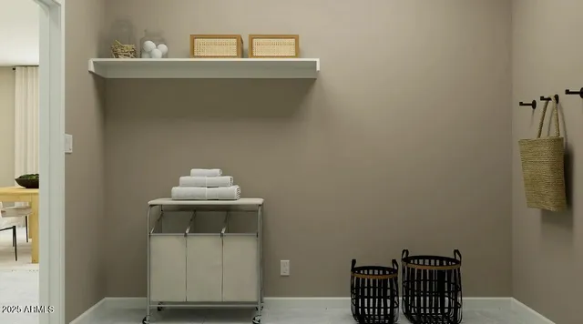 a view of a hallway with furniture and a window