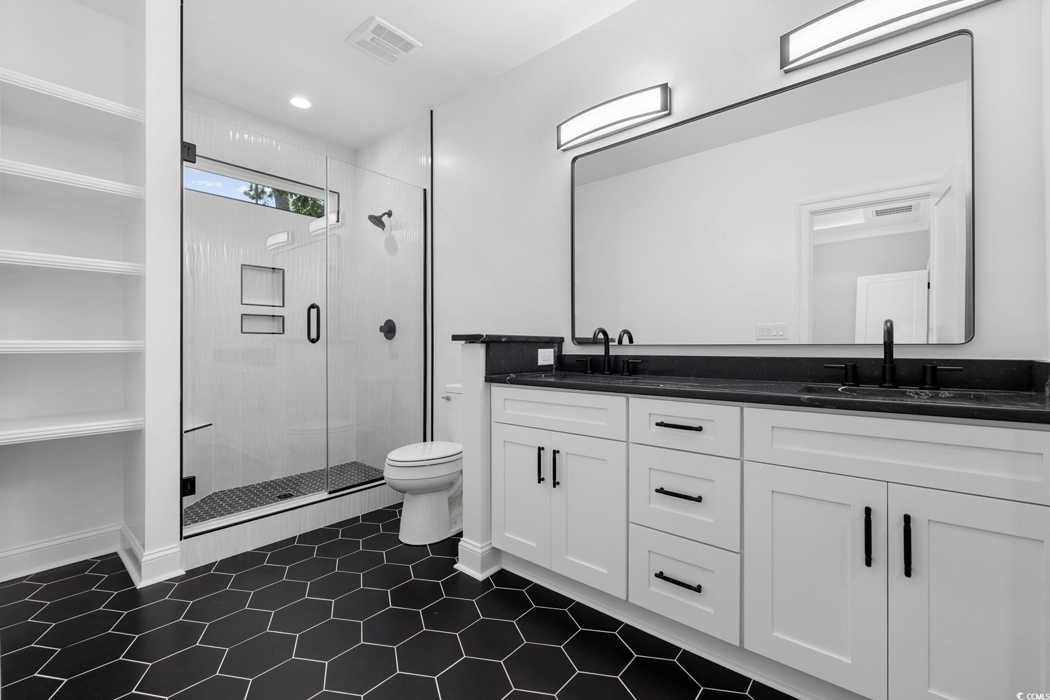 4806 North Kings Highway Myrtle Beach, SC 29577 - Photo 13 of 38 Full bath featuring double vanity, a shower stall, and recessed lighting