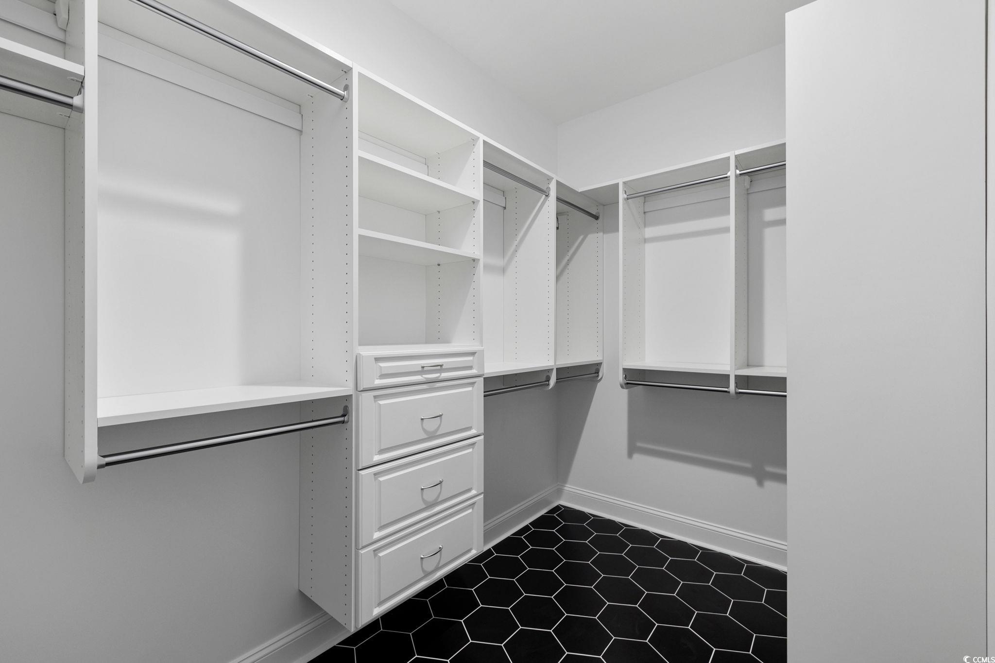 4806 North Kings Highway Myrtle Beach, SC 29577 - Photo 16 of 38 Walk in closet featuring dark floors