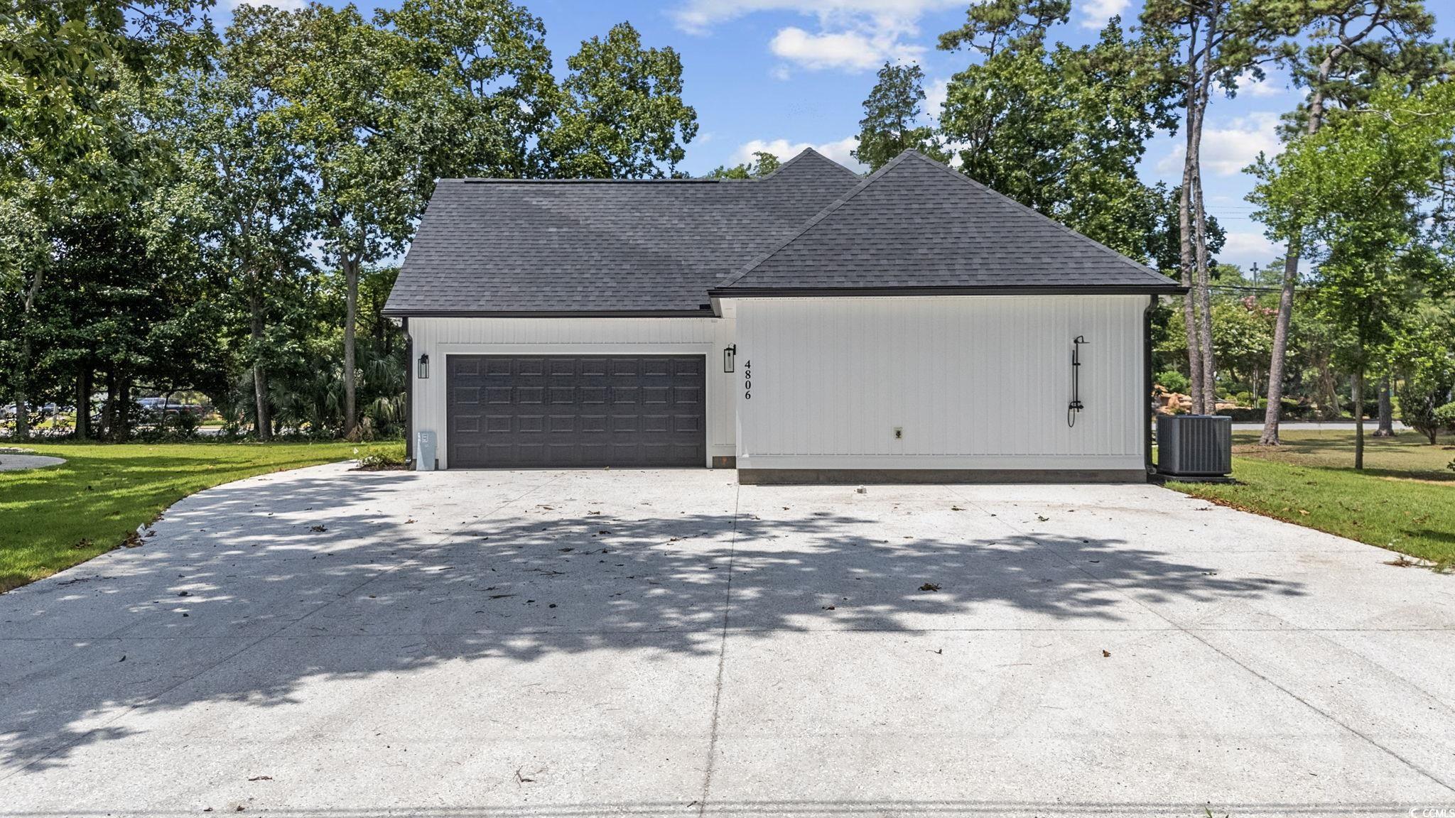 4806 North Kings Highway Myrtle Beach, SC 29577 - Photo 34 of 38 Garage featuring concrete driveway