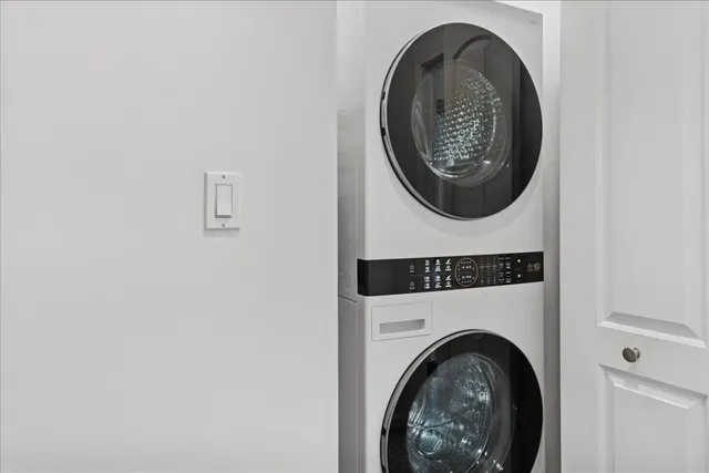 a view of a hallway with washer and dryer