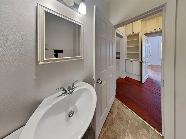 a bathroom with a sink and a mirror