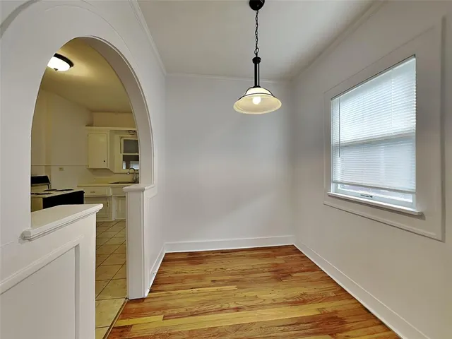 a view of a livingroom with a dishwasher and furniture