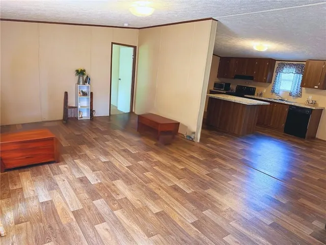 a kitchen with stainless steel appliances a refrigerator and a stove top oven
