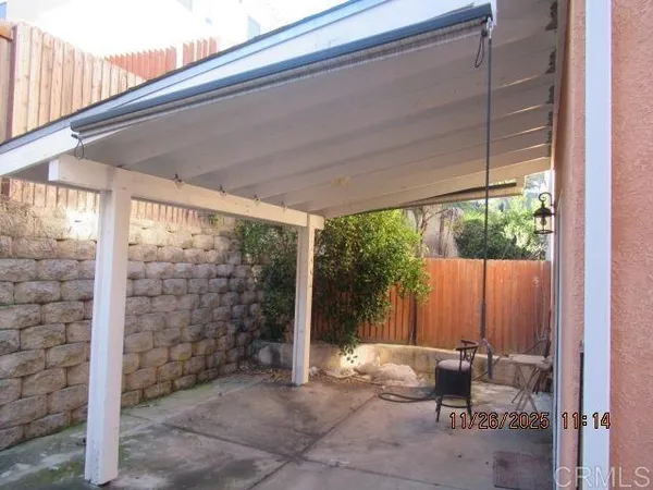a backyard of a house with outdoor seating