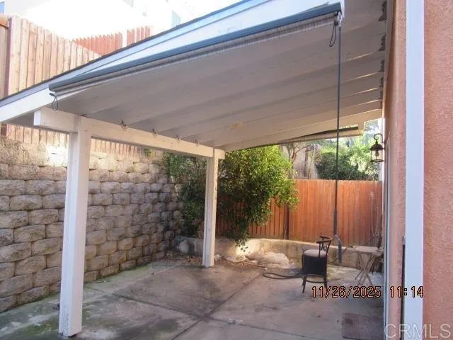 a backyard of a house with outdoor seating