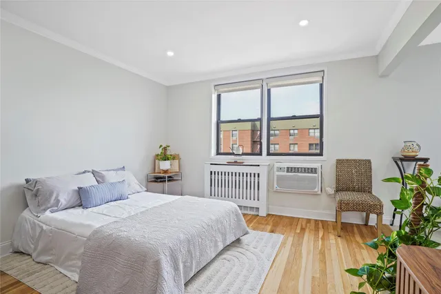 a bedroom with a large bed and a couch