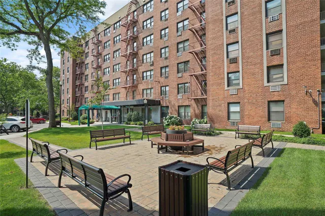 a picture of a bench in front of a building