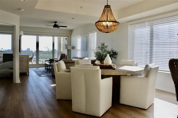 a living room with furniture a rug and a window