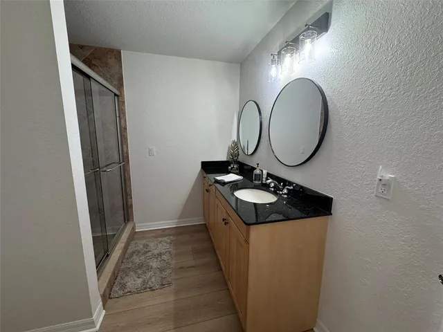 a view of balcony with wooden floor and outdoor seating