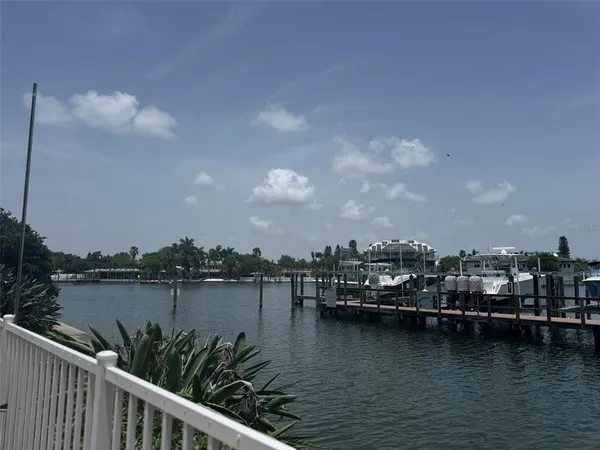 a view of a chairs and table in kitchen