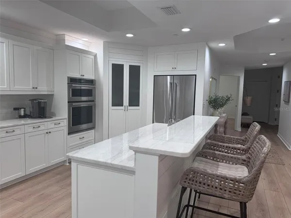 a kitchen with sink cabinets and window