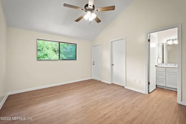 a view of an empty room with a fan