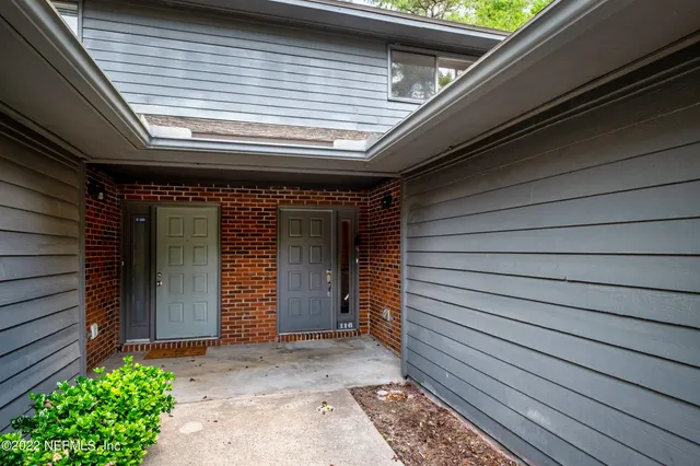 a backyard of a house with seating space