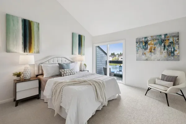 a bedroom with a bed and a couch