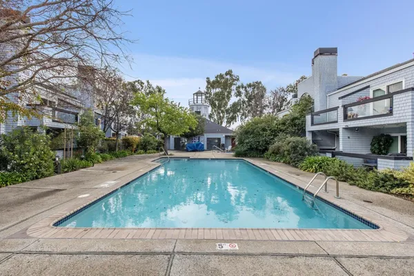 a view of a swimming pool with a yard