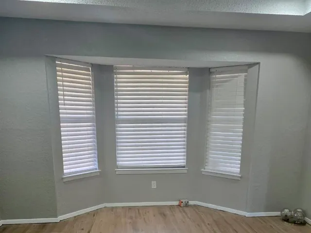 a view of an empty room with a window