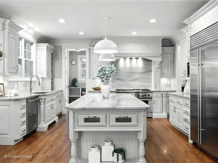 a bathroom with a toilet sink vanity and mirror