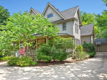 a view of a patio with table and chairs and potted plants