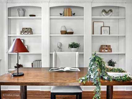 a view of an entryway with wooden floor and a large window