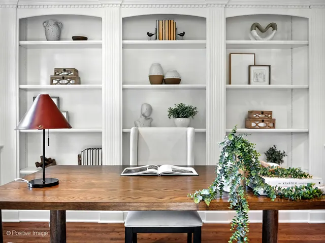 a view of an entryway with wooden floor and a large window