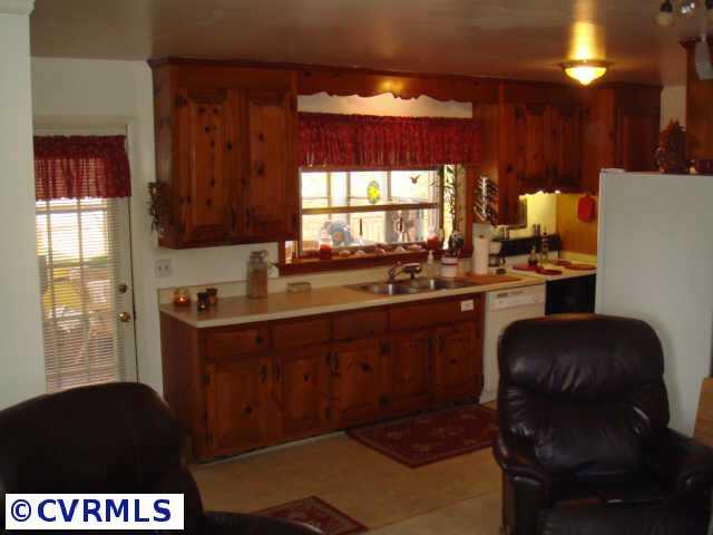 5428 Gilling Road Richmond, VA 23234 - Photo 9 of 10 Other - Kitchen with custoim natural wood cabinetry.
