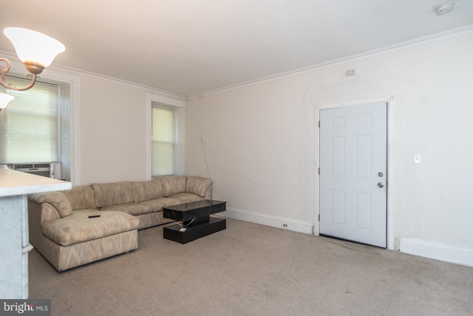 169 State Rd. Bensalem, PA 19020 - Photo 45 of 100 a living room with furniture and a lamp