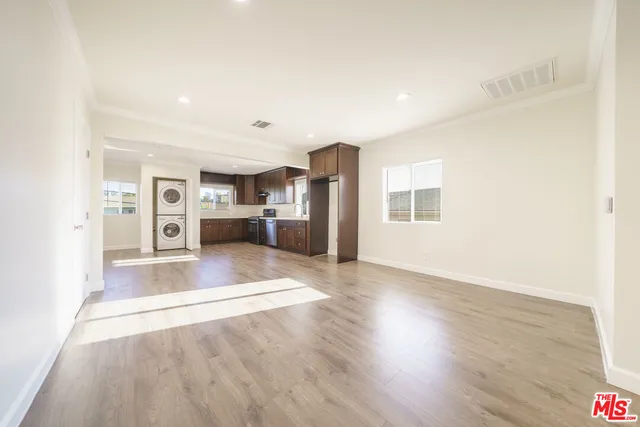 a view of kitchen with furniture and wooden floor