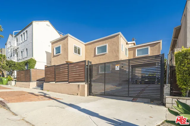 a view of a white building among the street