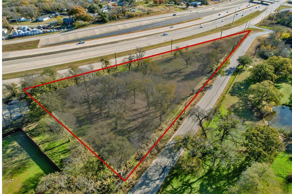 1716 Southeast Parkway Azle, TX 76020 - Photo 1 of 13 a close up of a lush green forest