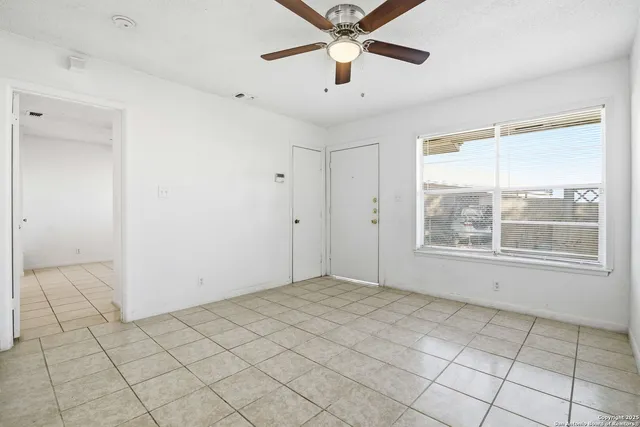 a view of an empty room and window