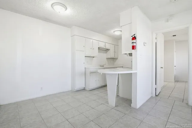 a kitchen with a sink cabinets and window