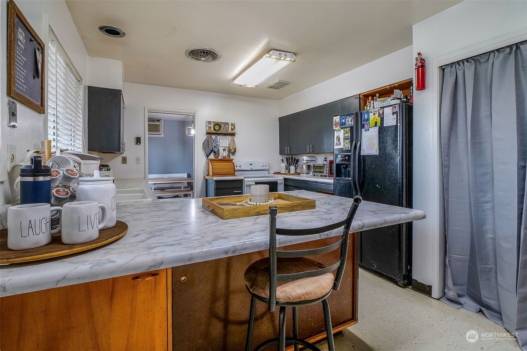 9012 B Bong Loop Moses Lake, WA 98837 - Photo 11 of 30 a kitchen with stainless steel appliances granite countertop sink stove and refrigerator