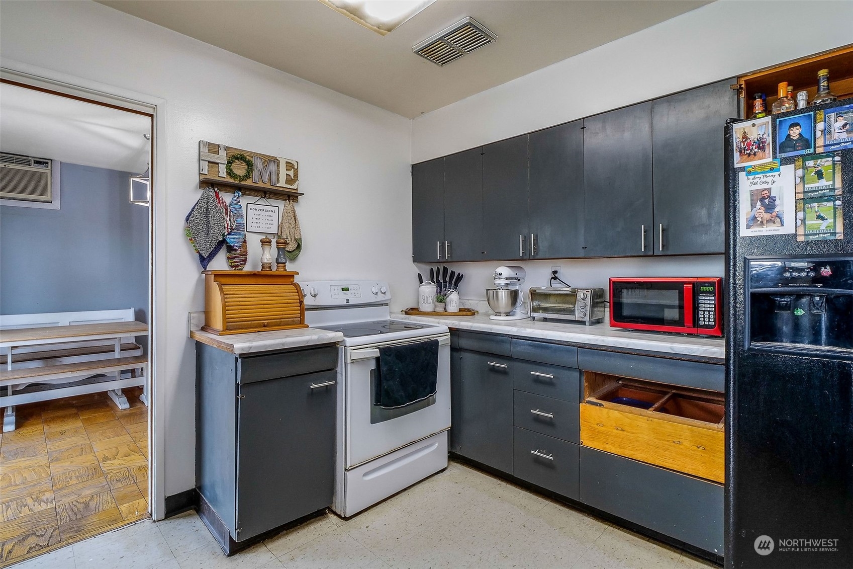 9012 B Bong Loop Moses Lake, WA 98837 - Photo 12 of 30 a kitchen with stainless steel appliances granite countertop a stove and a sink
