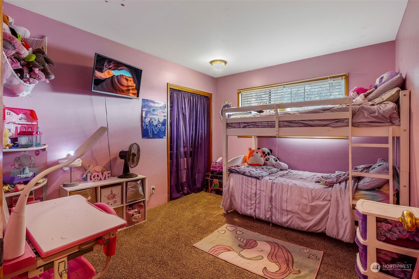 9012 B Bong Loop Moses Lake, WA 98837 - Photo 16 of 30 a bedroom with furniture and a chandelier