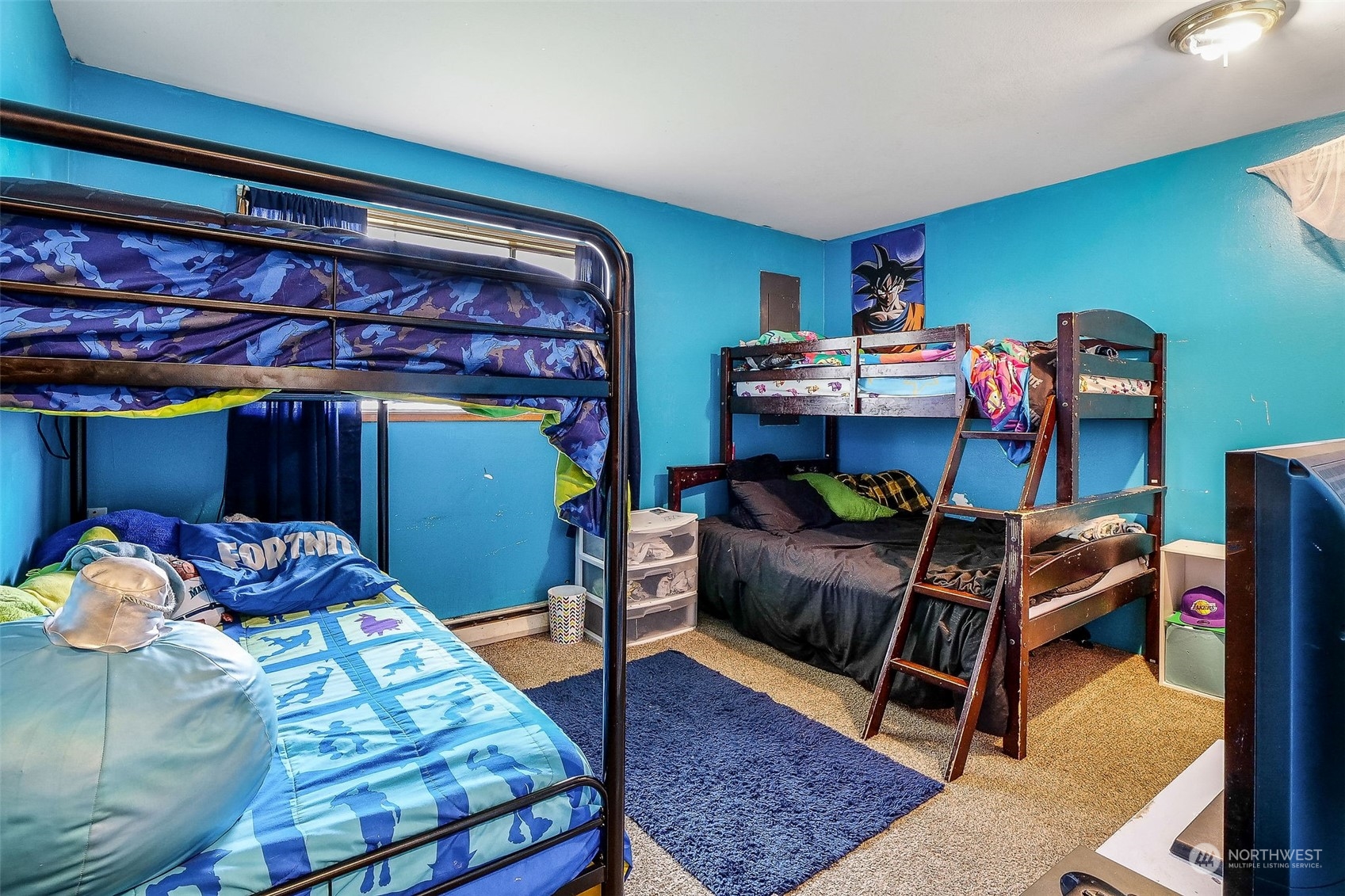 9012 B Bong Loop Moses Lake, WA 98837 - Photo 17 of 30 a bedroom with a bed and a chair